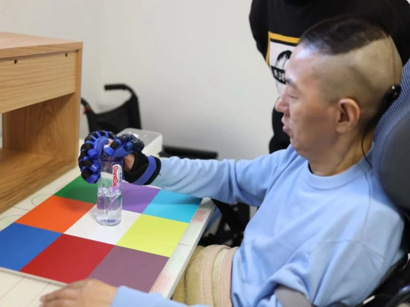 The first patient to receive the NEO brain-chip interface system is able to grasp objects with help from a prosthetic hand.