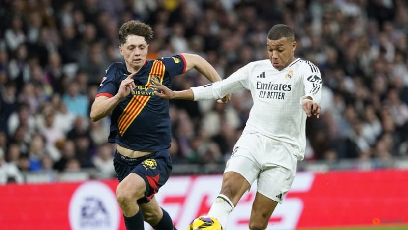 Real beat Girona 2-0 to move level on points with leaders Barcelona