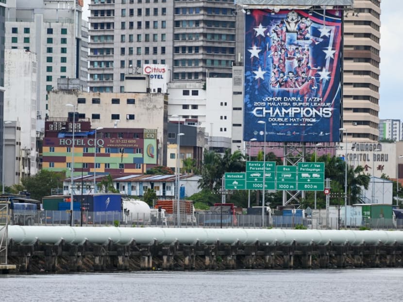A queue of trucks waiting to return to Malaysia's Johor state on a Causeway link, after delivery in Singapore on Nov 11, 2021.