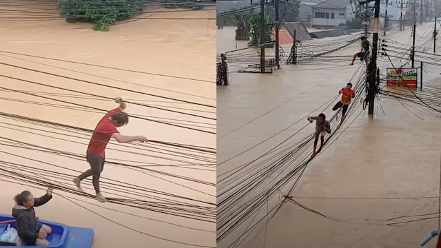 泰国宋卡洪水淹没房屋 民众爬电线逃生