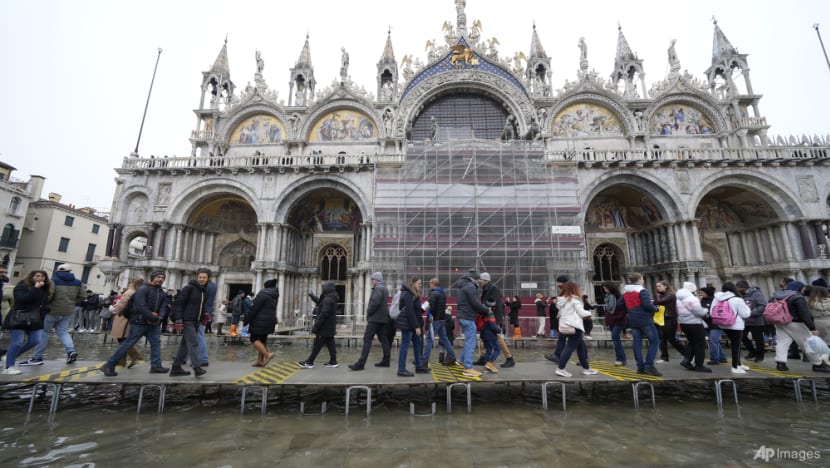 Climate activists pour mud and chocolate milk on St Mark's Basilica in Venice Climate activists pour mud and chocolate milk on St Mark's Basilica in Venice