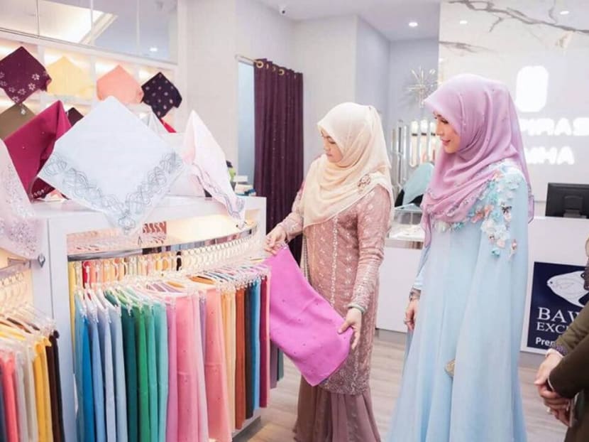 Customers browse Bawal Exclusive’s collection during the opening of its branch in Terengganu. Photo: MMO