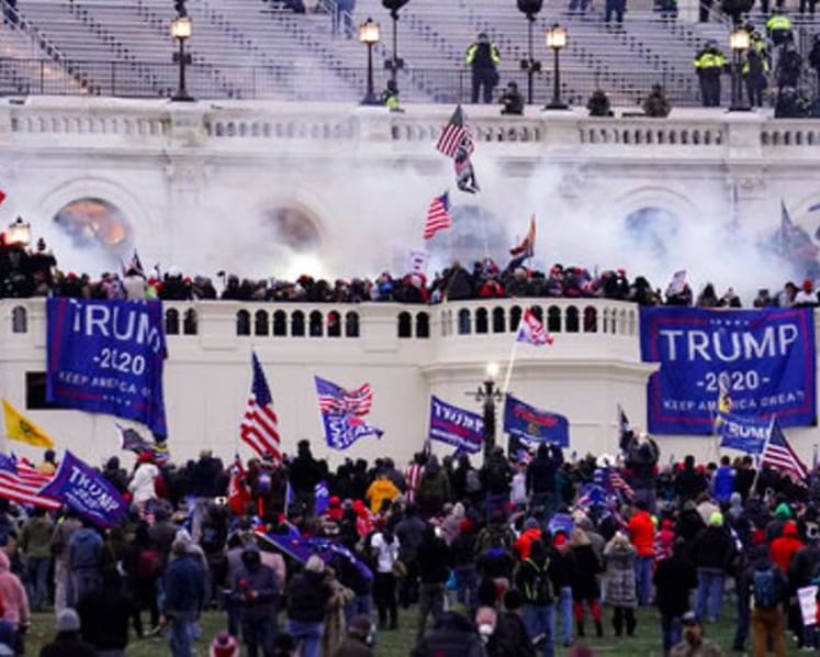 US intel report warns of more violence by QAnon followers