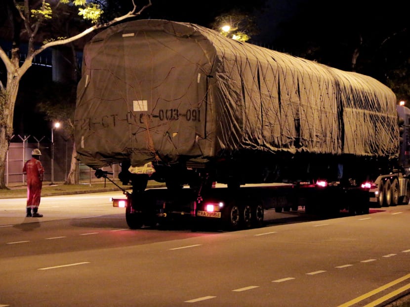 In the early morning of June 12, the defective trains are transported out of SMRT's Bishan Depot. (Photo: FactWire)