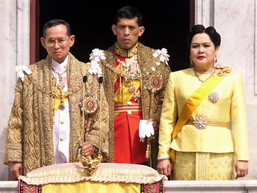 Thai King Bhumibol Adulyadej, Crown Prince Maha Vajiralongkorn and Queen Sirikit appearing at a balcony of Anantasamakom Throne Hall in Bangkok to mark the King's birthday on Dec 5, 1999. Photo: AFP