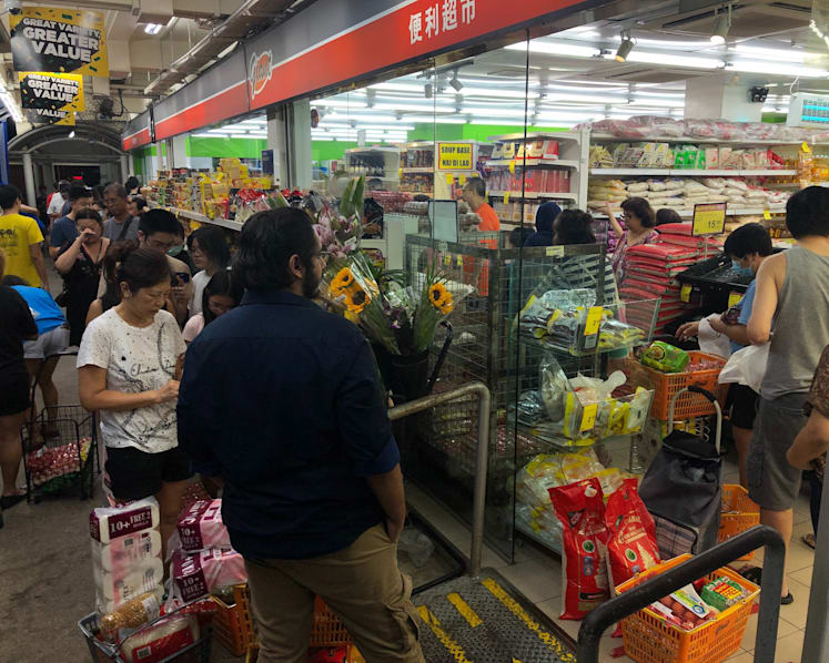 Singaporeans rush to supermarkets after Malaysia announces lockdown, but no widespread excessive buying