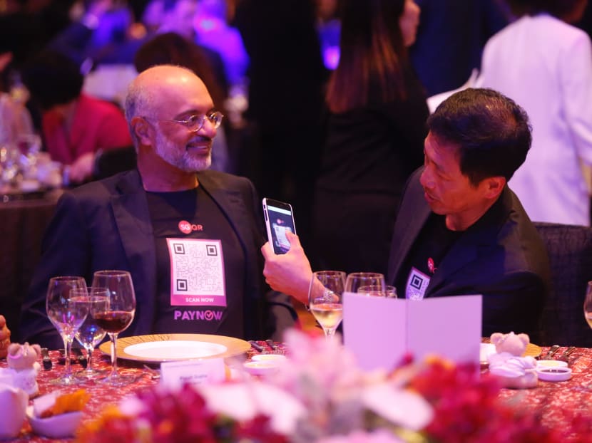 (From left) Mr Piyush Gupta, Chief Executive Officer and Director of DBS Group, and Education Minister Ong Ye Kung interacting during the Association of Banks in Singapore’s 45th Annual Dinner last year. Mr Ong, who is a board member of the Monetary Authority of Singapore, was asked about the current adoption rate of PayNow in Parliament.