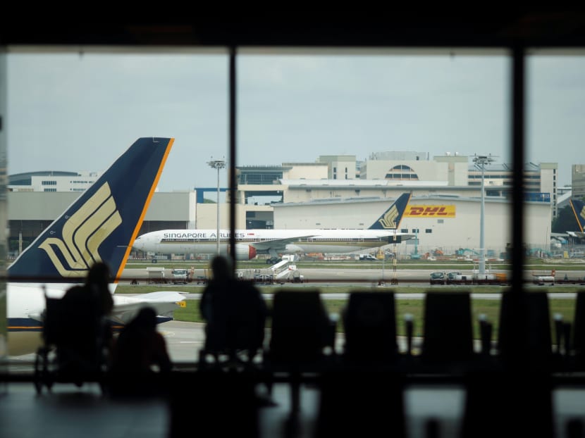 Singapore Airlines planes sit on the tarmac at Changi Airport in Singapore on Dec 8, 2020.