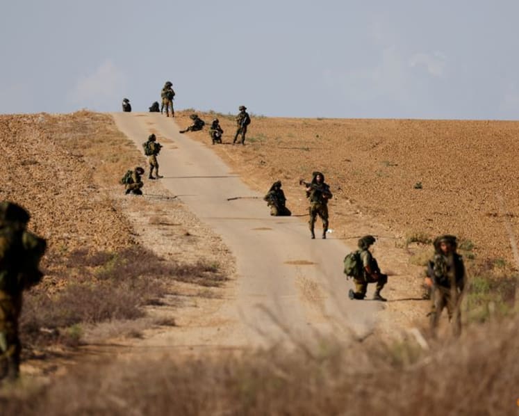 Gazans await 'life and death' aid, Israel readies invasion