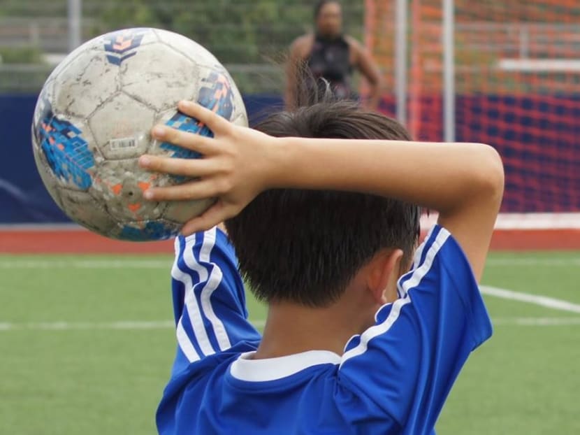With effect from this year, throw-ins have been replaced by kick-ins at all primary school matches. Photo: Stanley Ho/TODAY