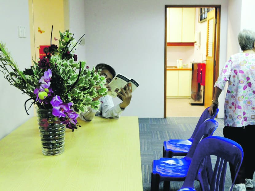 A pair of beneficiaries seen at the Singapore Association for Mental Health Centre at Jurong East. TODAY file photo