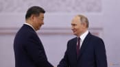 At Kremlin talks, Putin and Xi cast themselves as defenders of world order