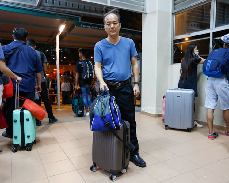 Malaysians brave long queues and traffic jams to beat the clock and avoid lockdown