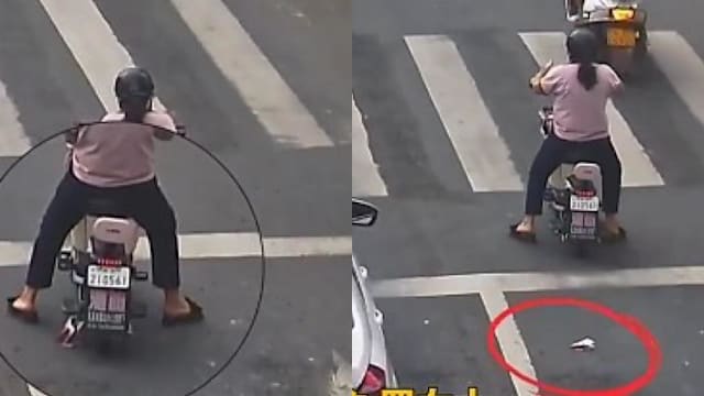 中国女子路上掉钱 路人见状一路追着还钱
