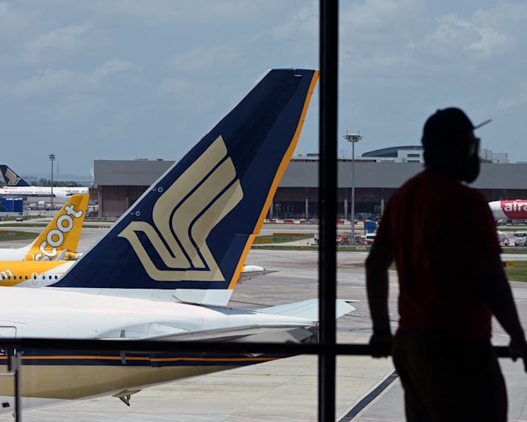 Singapore Airlines bomb hoax led to 4-hour disembarkation delay; man charged with causing alarm, assaulting cabin crew