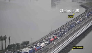 Travellers advised to defer non-essential travel to Johor as heavy rain worsens traffic at land checkpoints