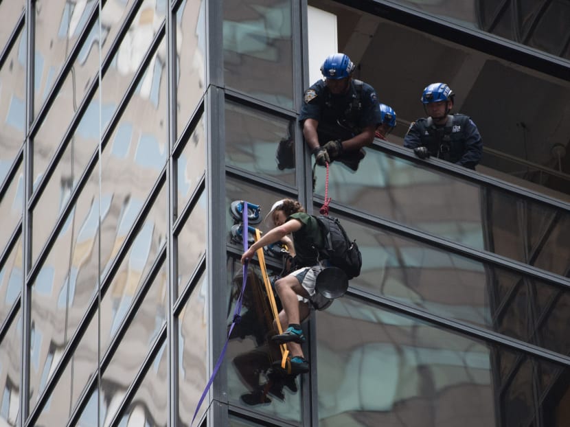Police had to remove a couple of windows in order to grab the climber who scaled up Trump Tower. Photo;: AFP