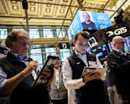Nasdaq sets record high, oil dips on improved crude flows