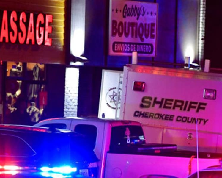Man in police custody after US massage parlour shootings leave 8 dead