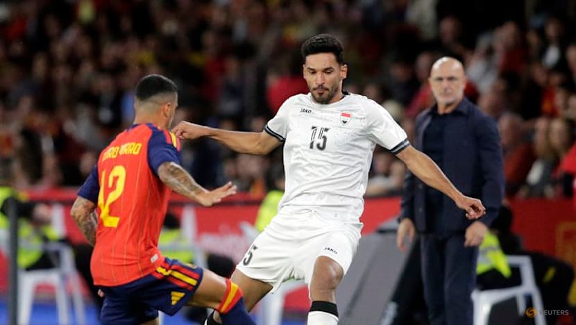 Second-string Spain held by Iraq in low-key World Cup send-off