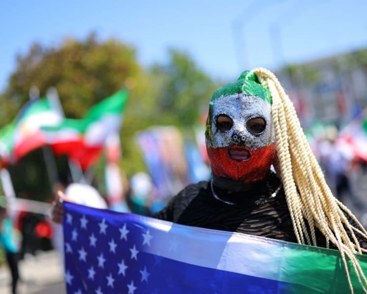 Iranian American protesters gather as soccer team prepare for World Cup opener