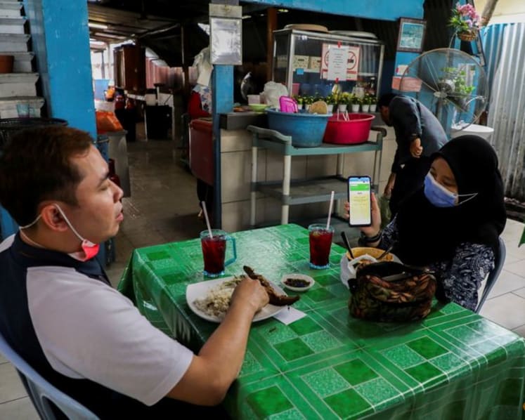 Malaysia's daily COVID-19 cases remain above 20,000; total tally goes beyond 1.6 million