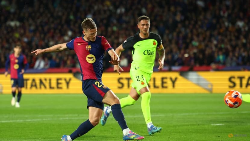 Olmo strikes to keep Barca's title charge on track