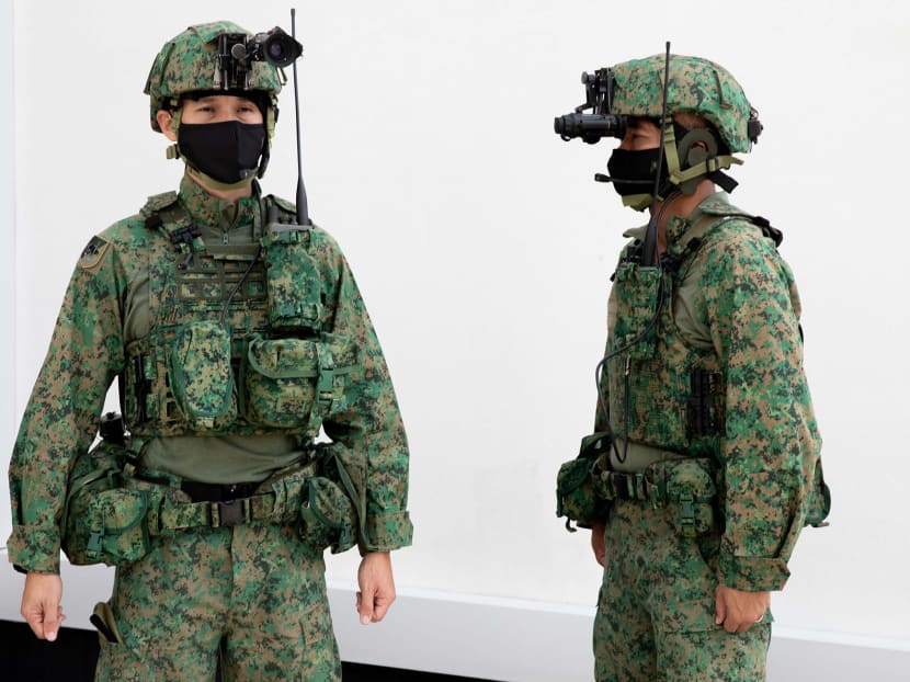 First Warrant Officer Heng Song Po (left) and Second Warrant Officer Steven Ong wearing the Army's enhanced personal equipment at Selarang Camp on Nov 20, 2020.