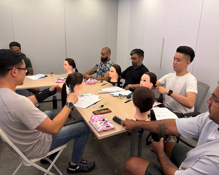 These stay-at-home dads started a workshop to help fathers style their daughters' hair