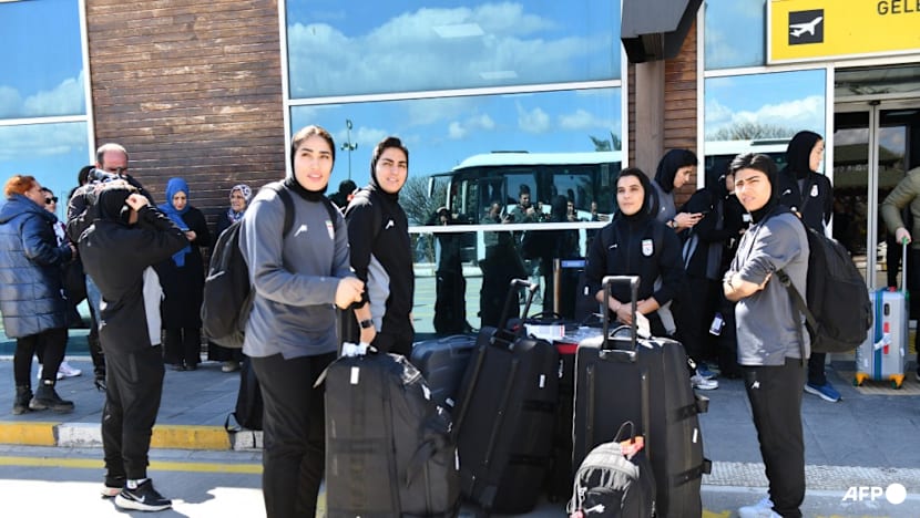 Iranian women's football team arrive back in Iran after some withdrew asylum claim