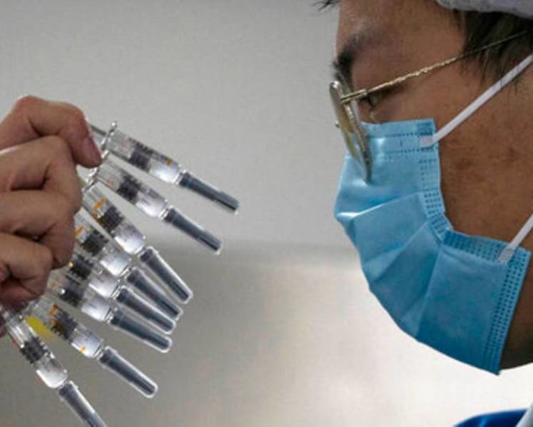 Commentary: COVID-19 vaccines - geopolitical rivalry and more could complicate roll-out