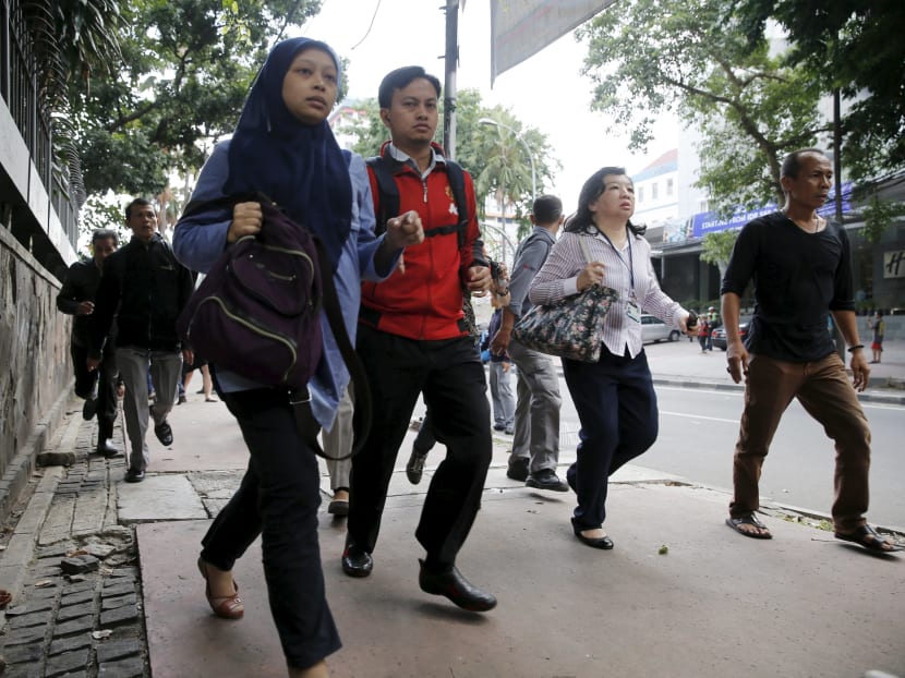 Seven dead in Jakarta blasts, gunfight