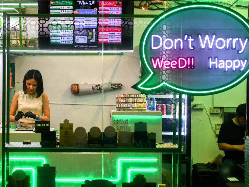 A woman works inside a cannabis shop, at Khaosan Road, one of the favourite tourist spots in Bangkok, Thailand, March 29, 2023.