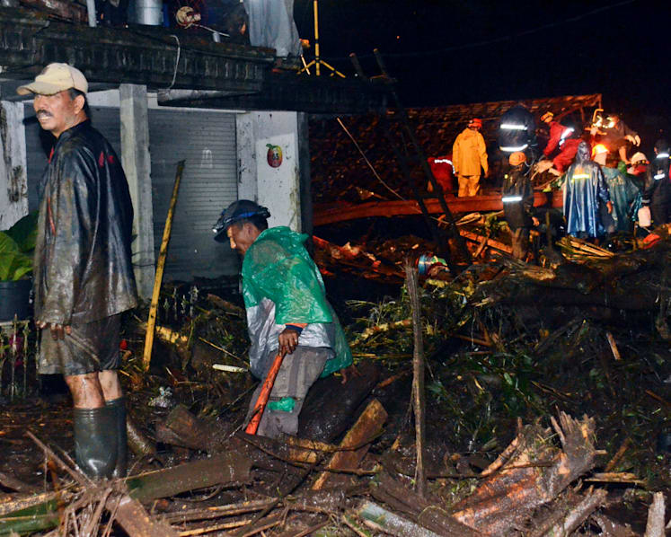 Flash floods in Indonesia kill at least 8, mud hampers relief work