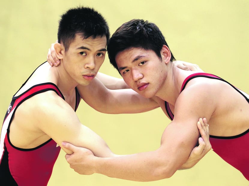 Wrestlers Gabriel Huang (left) and Toh Xin Ran now find it more difficult to market the sport to schools. Photo: Wee Teck Hian