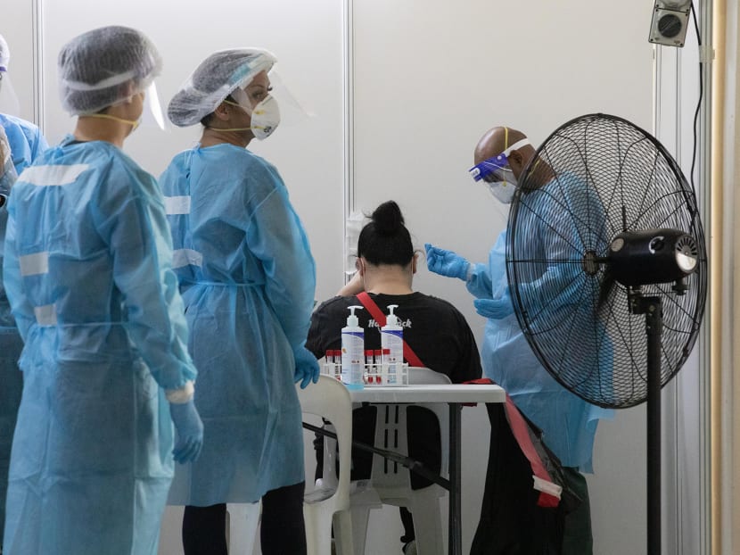 A woman getting her Covid-19 Swab test at Block 89 Redhill Close on June 22, 2021.