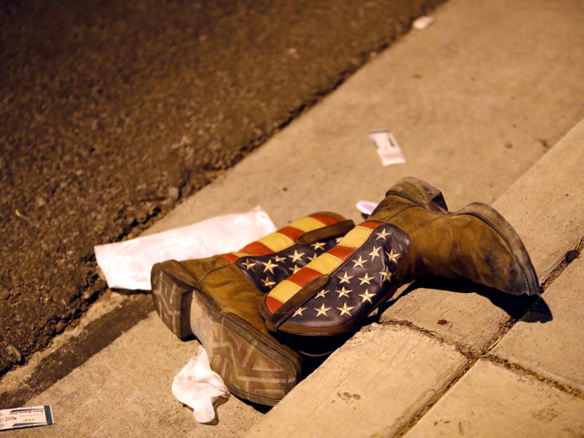 A pair of cowboy boots is shown in the street outside the concert venue after a mass shooting at a music festival on the Las Vegas Strip in Las Vegas, Nevada, US. Photo: Reuters