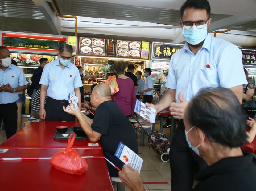 (Standing, from left to right): Mr Faisal Manap, Mr Leon Perera and Mr Pritam Singh of the Workers' Party on a walkabout in Aljunied GRC on July 2, 2020.