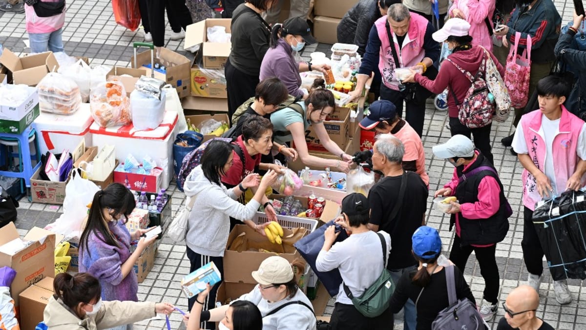 ‘Very worried’: Hong Kong fire survivors hunt for the missing
