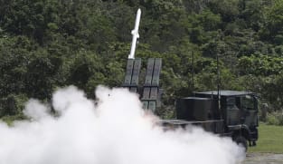 Taiwan says 'willing' to talk to China as island boosts defences
