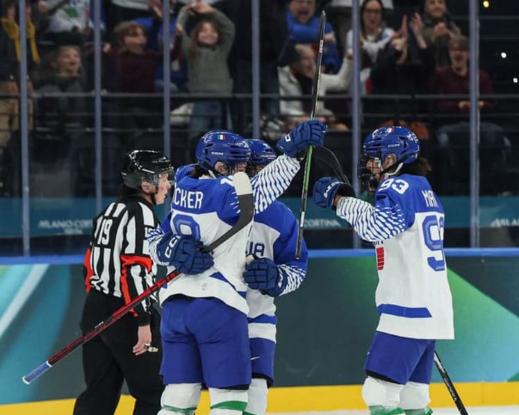 Ice hockey-Italian fans keep party going despite heavy defeat by Sweden