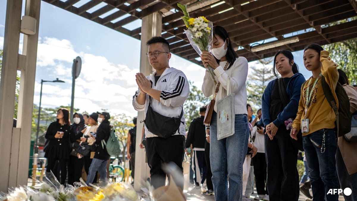 Hong Kong mourns victims of blaze that killed 128 and counting