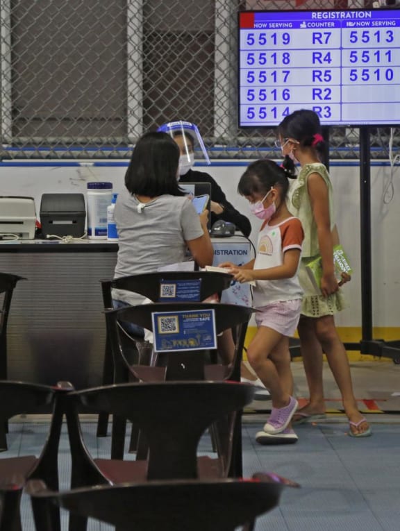 Parents and children at a vaccination centre for five- to 11-year-olds at Our Tampines Hub on Jan 12, 2022.