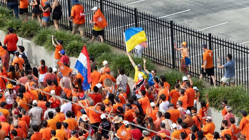 World Cup fans in Houston wave diverse flags, reflecting the city’s multicultural population