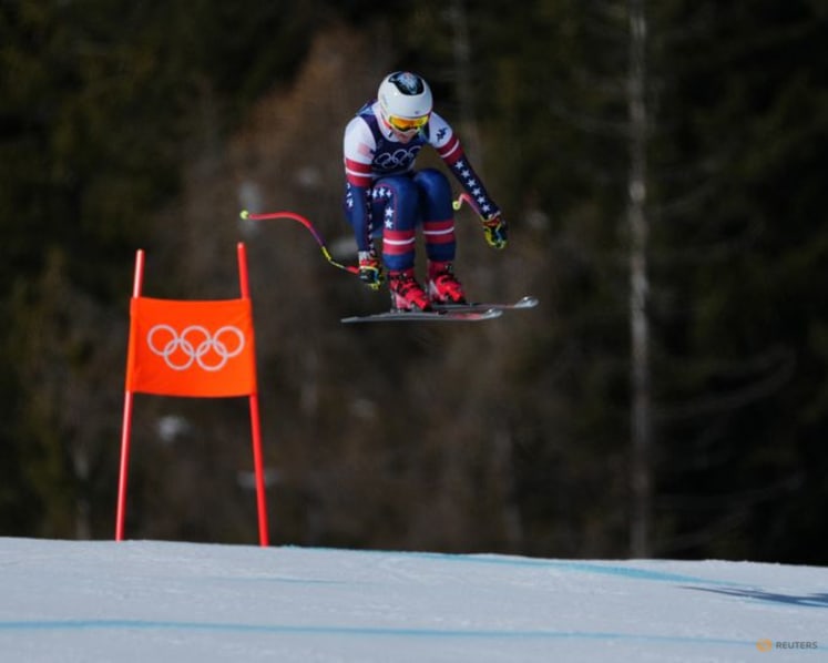 Alpine skiing-Johnson wins downhill after big crash for teammate Vonn