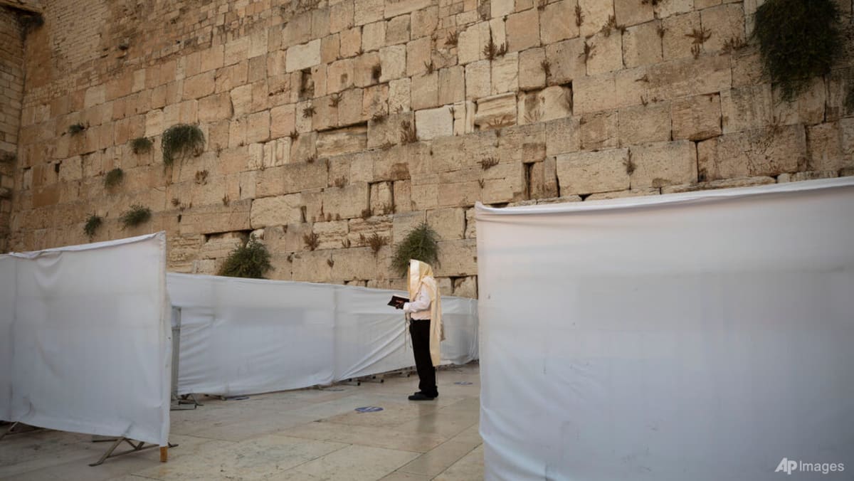 Israel allows up to 100 worshippers at Western Wall amid war restrictions