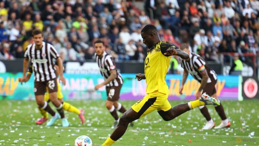 Dortmund concede two late goals to draw 3-3 at St Pauli in Bundesliga opener Dortmund concede two late goals to draw 3-3 at St Pauli in Bundesliga opener