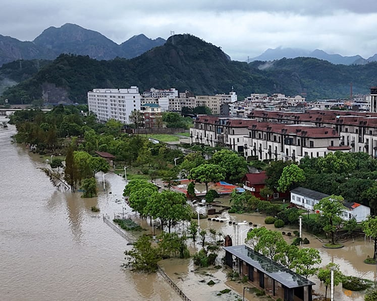 Typhoon Dolphin's vast storm system pushes inland, threatens central China