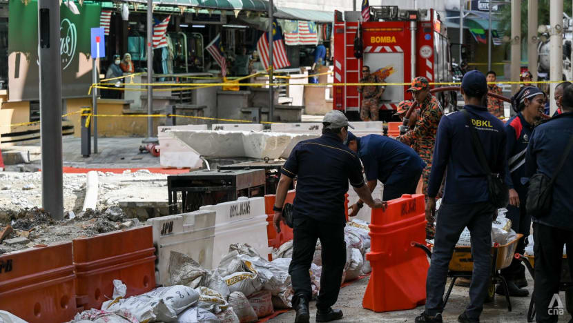 Malaysia searching manholes, sewage plant again for sinkhole victim as mayor declares Kuala Lumpur 'safe'