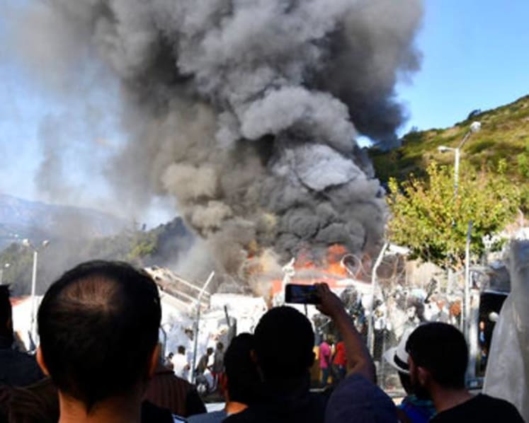 Fire burns tents, structures in Greek refugee camp